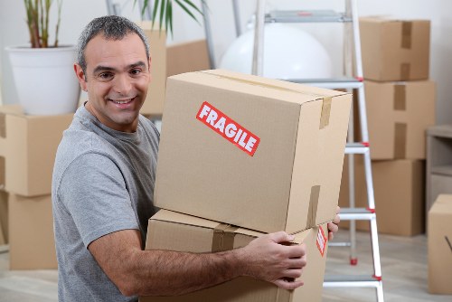 Removal team preparing household items for a move in Wales