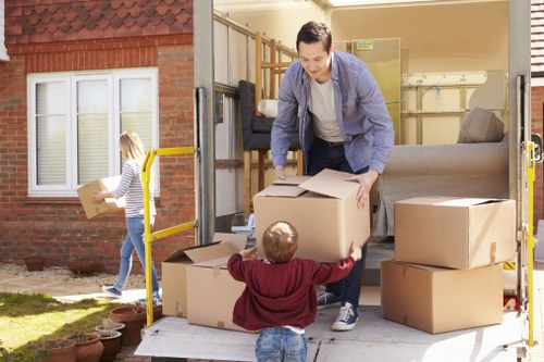 Professional removals staff using safety procedures on-site