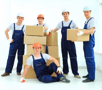 Movers handling flat removals in Wales in a city apartment block