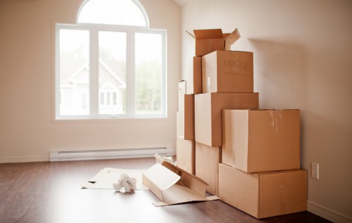 Packed office equipment ready for a commercial move in Wales