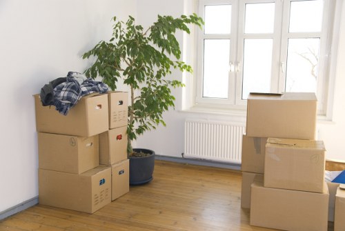 Moving equipment and wrapped furniture ready for transport across Wales