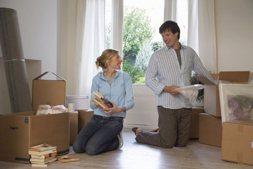 Organised business relocation with labeled boxes and IT equipment