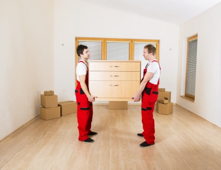 Trained movers handling furniture with care and proper technique